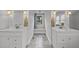 Bright bathroom featuring dual vanities, natural light, and neutral color scheme at 1541 Shadylawn Dr, Burlington, NC 27215