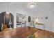 Open-concept dining room with hardwood floors and seating for six at 1541 Shadylawn Dr, Burlington, NC 27215
