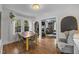 Open dining area with hardwood floors and views to the living room at 1541 Shadylawn Dr, Burlington, NC 27215