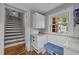 Mud room with a built-in bench, storage, and access to the stairs at 1541 Shadylawn Dr, Burlington, NC 27215