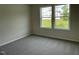 Comfortable carpeted bedroom offers a bright, airy ambiance, perfect for relaxation at 180 Tulipfield Way, Benson, NC 27504
