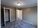Bedroom featuring plush carpeting and a standard closet with a view to another room at 195 Washington Ln, Cameron, NC 28326