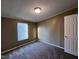 Bedroom with neutral walls, plush carpeting, and natural light from a window at 195 Washington Ln, Cameron, NC 28326
