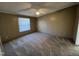 Comfortable bedroom with neutral walls, carpet, a ceiling fan, and a window allowing natural light at 195 Washington Ln, Cameron, NC 28326