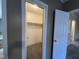 Open walk-in closet showing ample storage space and access to other areas of the home at 195 Washington Ln, Cameron, NC 28326