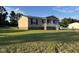 Charming single-story home featuring a welcoming front porch and a well-maintained lawn at 195 Washington Ln, Cameron, NC 28326