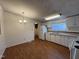 Bright eat-in kitchen with white appliances, laminate flooring, and a cozy dining area at 195 Washington Ln, Cameron, NC 28326