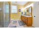 Bathroom with a glass enclosed shower, a double sink vanity with wood cabinets, and a tiled floor at 200 Daniel Ridge Ln, Roxboro, NC 27574