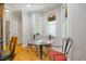Sunlit breakfast nook features large windows and seating for three at 200 Daniel Ridge Ln, Roxboro, NC 27574