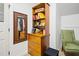 Built-in closet storage with drawers and shelving featuring bags, boxes, and a mirror, plus a green chair at 200 Daniel Ridge Ln, Roxboro, NC 27574