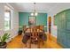 Formal dining area featuring hardwood floors, elegant furniture, and ample natural light at 200 Daniel Ridge Ln, Roxboro, NC 27574