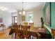 Bright dining room features hardwood floors and decorative chair rail molding at 200 Daniel Ridge Ln, Roxboro, NC 27574