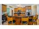 Eat-in kitchen with granite countertops, stainless steel appliances, and a center island with bar seating at 200 Daniel Ridge Ln, Roxboro, NC 27574
