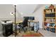 Dedicated home office space featuring built-in shelving, natural light, and modern desk setup at 200 Daniel Ridge Ln, Roxboro, NC 27574