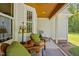 Cozy screened porch with comfortable seating, offering a relaxing outdoor living space at 200 Daniel Ridge Ln, Roxboro, NC 27574