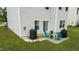 Backyard patio featuring outdoor seating and grill, offering a cozy space for relaxation and entertainment at 2004 Tennessee Rd, Durham, NC 27704