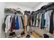 Walk-in closet with an abundance of hanging clothes, shelving, and shoe storage at 2004 Tennessee Rd, Durham, NC 27704