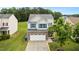 Inviting home with stone accents, attached garage, blue shutters, and well-kept landscaping at 2004 Tennessee Rd, Durham, NC 27704