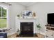 Close up of a fireplace with white mantel and decor at 2004 Tennessee Rd, Durham, NC 27704