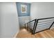 Modern staircase with wood steps, metal railing, and natural light at 2004 Tennessee Rd, Durham, NC 27704
