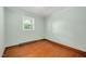 This bedroom offers hardwood floors and a window offering natural light at 202 Hamilton Rd, Bunnlevel, NC 28323