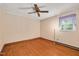 Bedroom featuring hardwood floors, a ceiling fan, a light fixture and a window at 202 Hamilton Rd, Bunnlevel, NC 28323