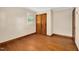 Bedroom with hardwood floors, closet, and window at 202 Hamilton Rd, Bunnlevel, NC 28323