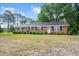 Charming single-story brick home featuring a cozy front yard and traditional curb appeal at 202 Hamilton Rd, Bunnlevel, NC 28323