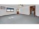 A spacious, bright living room with natural light and neutral-colored carpets at 202 Hamilton Rd, Bunnlevel, NC 28323