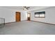 A spacious living room with a ceiling fan and stairs leading up to the upper level at 202 Hamilton Rd, Bunnlevel, NC 28323