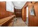 Mud room features wood paneling, built in shelves, and a utility sink at 202 Hamilton Rd, Bunnlevel, NC 28323