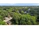 Aerial view of neighborhood showcasing the property nestled among lush greenery and trees at 203 W Boundary St, Cary, NC 27513
