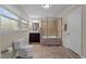 Bathroom with a dark wood vanity and a step-up tiled shower/tub enclosure at 203 W Boundary St, Cary, NC 27513
