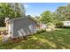 Exterior view of the property with a gray painted exterior with brick and manicured lawn at 203 W Boundary St, Cary, NC 27513