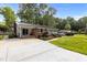 Beautiful single story home with a long driveway and mature trees in a quiet setting at 203 W Boundary St, Cary, NC 27513