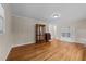 Spacious living room with hardwood floors, ample storage, and a display case at 203 W Boundary St, Cary, NC 27513
