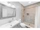 Bright bathroom with a modern vanity, framed mirror, and a tiled walk-in shower at 205 Slate Blue Pl, Cary, NC 27519