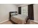 Bright bedroom with large window and plush bedding, creating a cozy and inviting space at 205 Slate Blue Pl, Cary, NC 27519