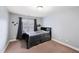 Bedroom with neutral walls, carpet, and a window with grey curtains at 205 Slate Blue Pl, Cary, NC 27519