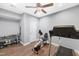 Home gym featuring exercise equipment and wood-look flooring in a well lit room at 205 Slate Blue Pl, Cary, NC 27519