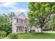 Charming two-story home featuring a welcoming front porch with rocking chairs and a well-manicured lawn at 205 Slate Blue Pl, Cary, NC 27519