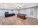 Spacious game room with a pool table, a leather couch, and recessed lighting at 205 Slate Blue Pl, Cary, NC 27519