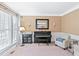 Cozy living room featuring a piano, comfortable seating, and ample natural light from the large windows at 205 Slate Blue Pl, Cary, NC 27519
