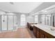 Large bathroom featuring dual vanities, glass shower, and large windows at 205 Slate Blue Pl, Cary, NC 27519