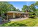 Backyard featuring a patio, mature trees and grilling area at 2053 Nottingham Ln, Burlington, NC 27215