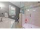 Elegant bathroom boasts a tiled shower with a glass enclosure at 2053 Nottingham Ln, Burlington, NC 27215