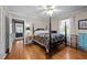 Comfortable bedroom features a ceiling fan and inviting four-poster bed at 2053 Nottingham Ln, Burlington, NC 27215
