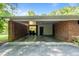 Spacious carport made of brick with concrete flooring at 2053 Nottingham Ln, Burlington, NC 27215