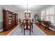 Traditional dining room with hardwood floors, a large table, and elegant china cabinet at 2053 Nottingham Ln, Burlington, NC 27215