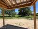Open-air back porch showing beautiful scenery of the backyard and surrounding wooded area at 209 Atkins Rd, Cameron, NC 28326